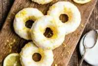 Soft and citrusy Lemon Vanilla Protein Donuts with Glaze topped with creamy icing, perfect for a High Protein Donut Recipe and healthy Glazed Protein Donuts breakfast treat.