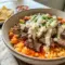 Creamy Steak Queso Rice Bowl topped with juicy steak, avocado, and queso sauce for easy Mexican Dinner Ideas For Family and flavorful Recipes Made With Steak.