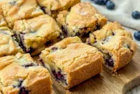 Blueberry Blondies – Soft and Chewy White Chocolate Blueberry Dessert Bars1 Freshly baked Blueberry Blondies filled with juicy blueberries and white chocolate, a delicious Dessert Bar Recipe perfect for summer gatherings and sweet cravings.
