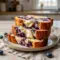 Blueberry Cream Cheese Bread looks so soft and inviting in this cozy loaf shot, with a tender crumb that highlights Baking Cream Cheese for a rich bakery-style finish.