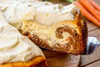 Beautiful slice of Carrot Cake Cheesecake with creamy layers and rich frosting, featuring a stunning Carrot Cake Cheesecake Swirl and Carrot Cake Cheesecake With Cream Cheese Frosting.