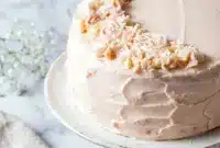 Elegant Pink Champagne Cake with delicate pink layers and a beautiful Cake With Pink Icing, perfect for Womens Birthday Cakes and Pretty Cakes For Women Birthdays.