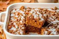 Pumpkin Coffee Cake with Crumble Topping and Sweet Vanilla Glaze1 Freshly glazed Pumpkin Coffee Cake with buttery streusel layers, served as a delicious Pumpkin Coffee Cake Slice and classic Pumpkin Cake With Crumble Topping.