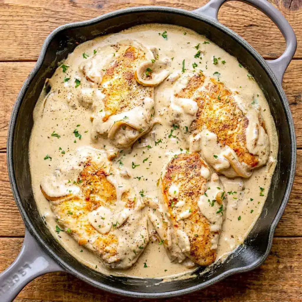Creamy Sour Cream and Onion Chicken served in a skillet with rich onion sauce, perfect for a Low Carb Dinner and easy Chicken Main Dishes.