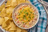 Boat Dip served in a colorful bowl with tortilla chips, a crowd-pleasing Rotel Boat Dip Recipe for easy summer snacking.