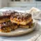 Easy Turtle Bars on a dessert tray with gooey caramel and chocolate, perfect for Coconut Chocolate Bars lovers.
