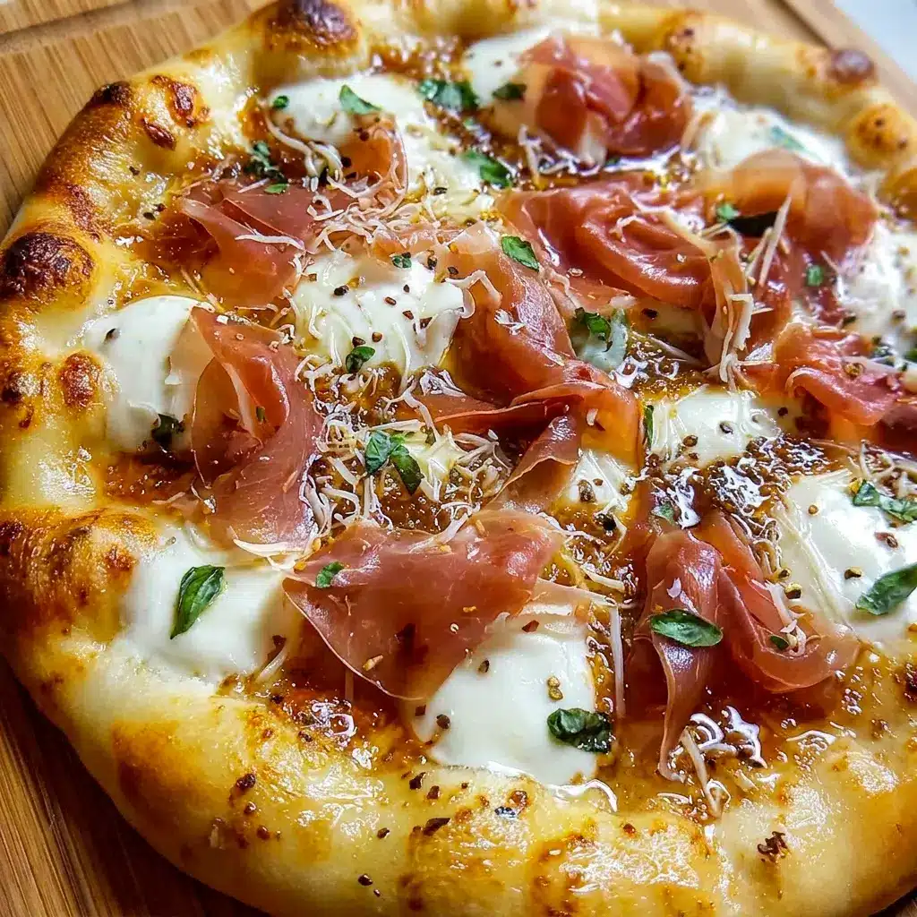 Crispy crust White Pizza with Prosciutto & Hot Honey with melted mozzarella and ricotta, inspired by elegant Recipes With Prosciutto.