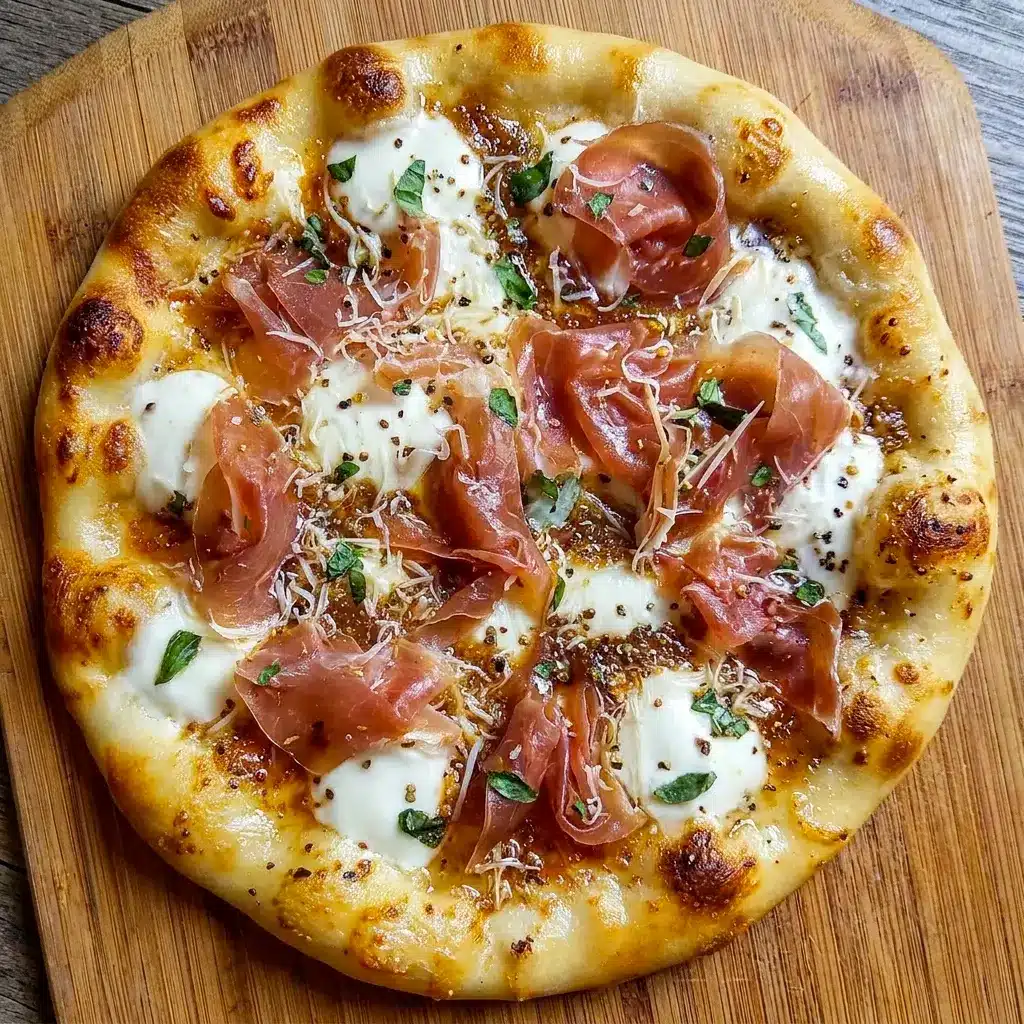 A golden White Pizza with Prosciutto & Hot Honey topped with creamy cheese and crisp prosciutto, perfect for a homemade Specialty Pizza night.