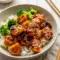 Glazed in a sticky citrus sauce, these Crispy Orange Salmon Bowls are one of the best Orange Dinner Recipes for a quick weeknight meal.