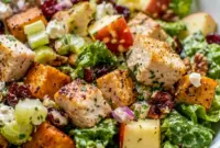 Roasted chicken, sweet potatoes, and crisp romaine fill this Fall Chicken Chopped Salad, one of the Best Salads With Chicken for cozy weeknights.