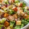 Roasted chicken, sweet potatoes, and crisp romaine fill this Fall Chicken Chopped Salad, one of the Best Salads With Chicken for cozy weeknights.