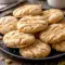 A batch of Soft Maple Sugar Cookies cooling on a tray, drizzled with icing as part of a simple Baking project for fall.