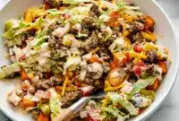 Layered with beef, cheese, and sauce, this Sweet Potato Burger Bowl is one of the best Ground Beef Recipes for a healthier weeknight dinner.